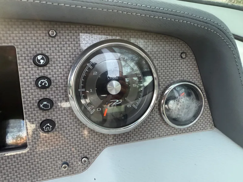Slide: The Image of Dashboard of 2013 Regal 2500 Bowrider boat with gauges and controls. - 38