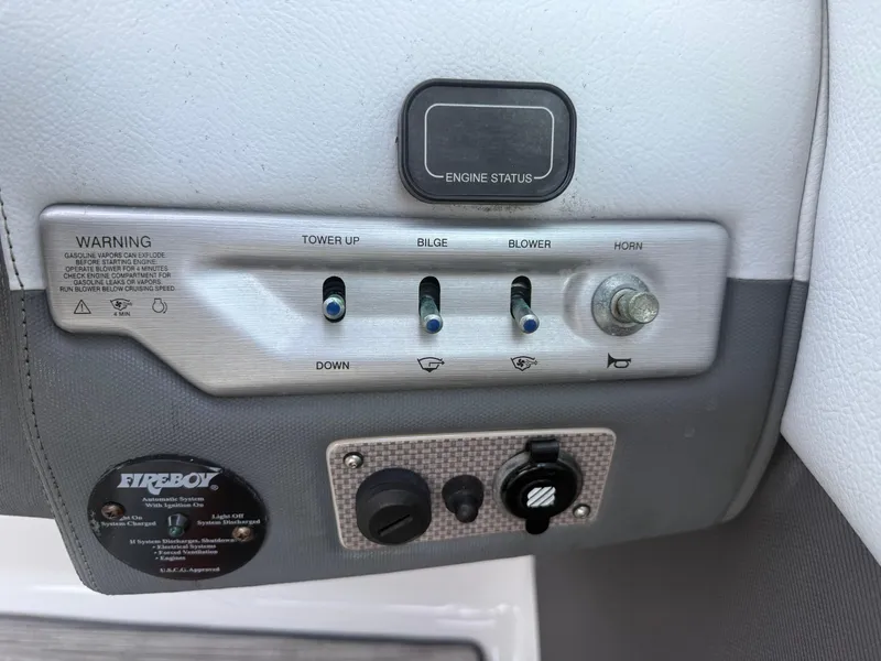 Slide: The Image of Control panel of a 2013 Regal 2500 Bowrider boat with switches and engine status. - 41