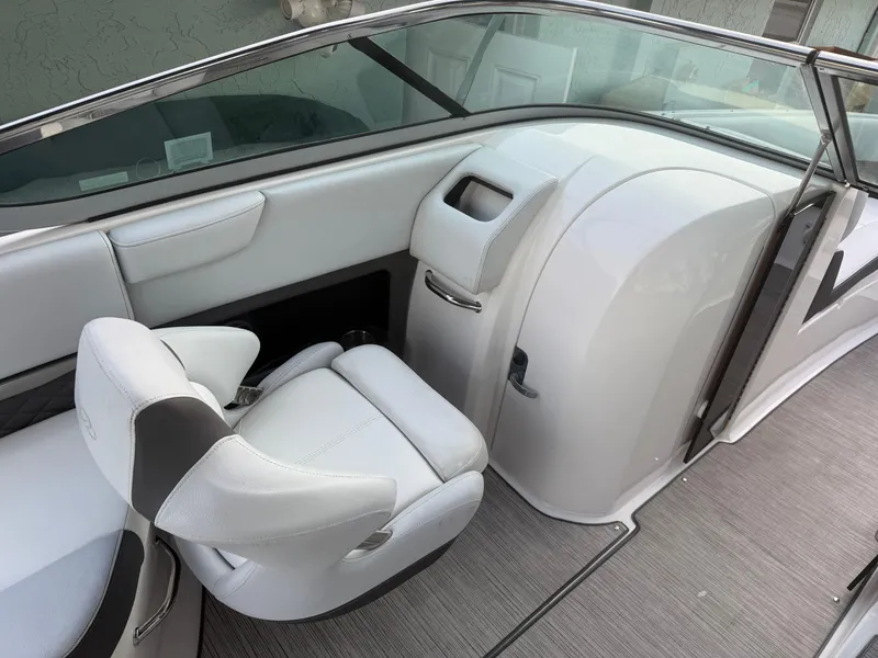 Slide: The Image of 2013 Regal 2500 Bowrider interior with sleek white seating and modern dashboard design. - 42