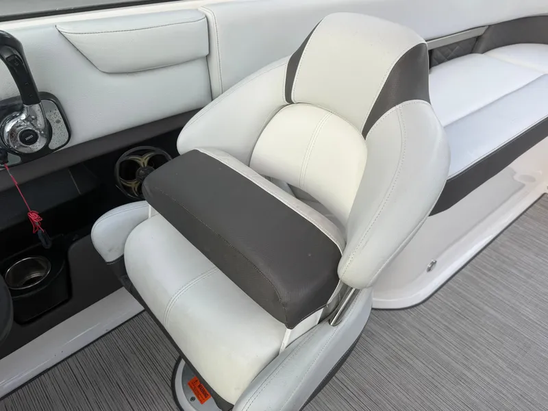 Slide: The Image of 2013 Regal 2500 Bowrider interior, featuring a plush, ergonomic captain's chair. - 44