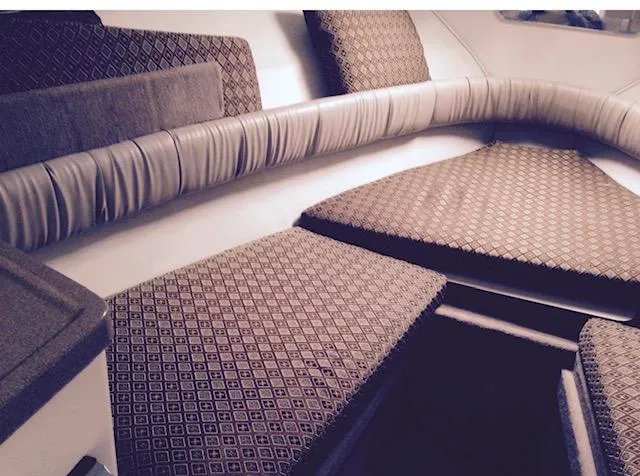 Slide: The Image of Interior cabin of a 1998 Doral 2500 SC boat with patterned cushions. - 4