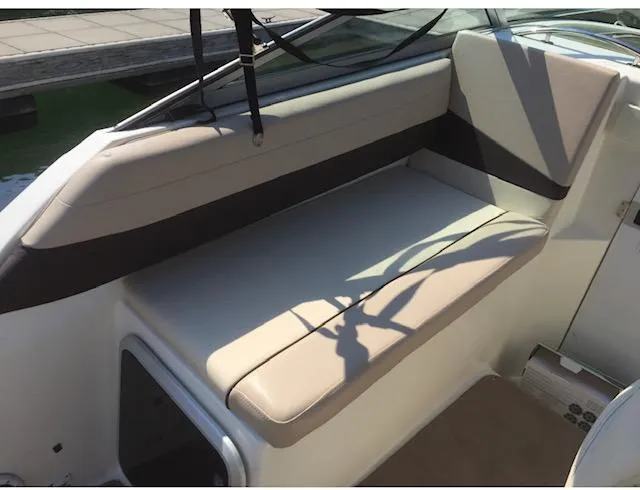 Slide: The Image of 1998 Doral 2500 SC boat interior seating area. - 9