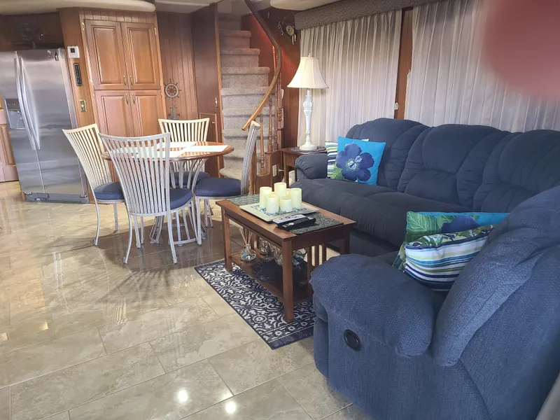 Slide: The Image of Interior of 2003 Monticello River Yacht with cozy seating and dining area. - 17