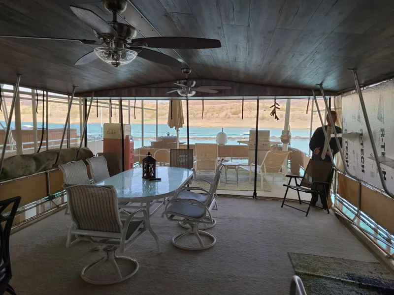 Slide: The Image of 2003 Monticello River Yacht interior with dining area and lake view. - 26