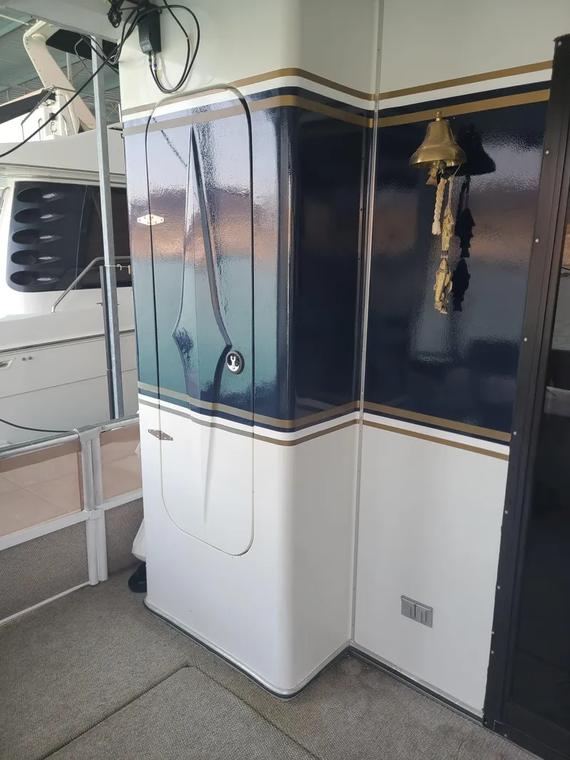 Slide: The Image of 2003 Monticello River Yacht interior with nautical decor and bell. - 6