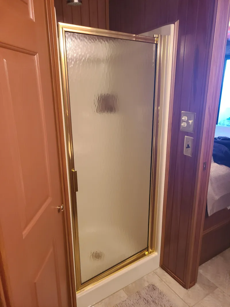 Slide: The Image of Shower stall with gold trim in 2003 Monticello River Yacht bathroom. - 9