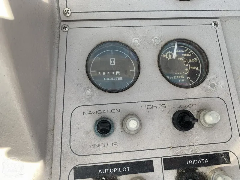 Slide: The Image of Close-up of 1994 Cruisers Yachts Express Bridge dashboard controls and gauges. - 16