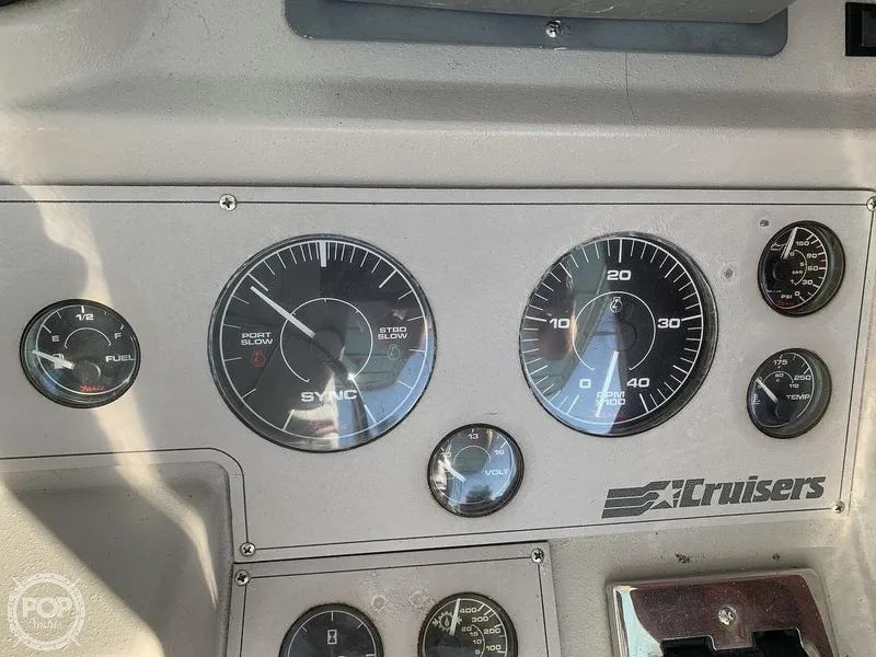 Slide: The Image of Dashboard of a 1994 Cruisers Yachts Express Bridge with gauges and controls. - 9
