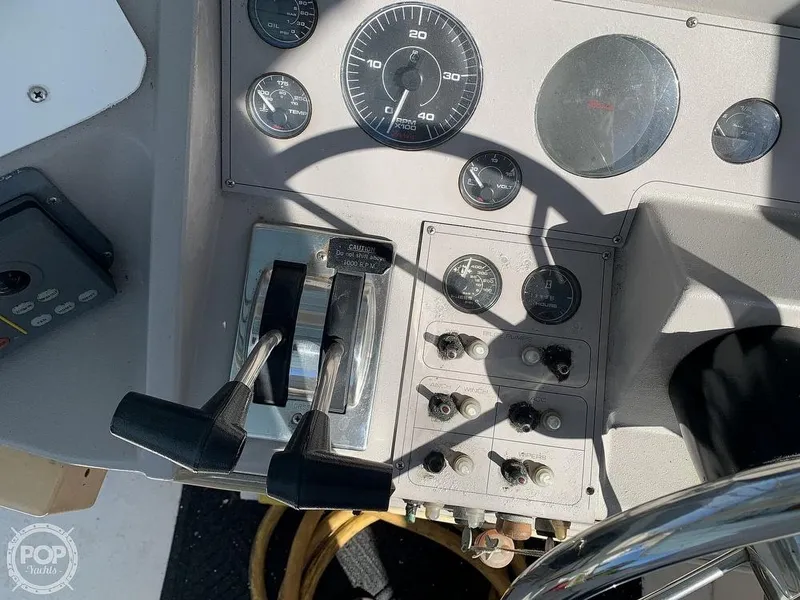 Slide: The Image of Close-up of 1994 Cruisers Yachts Express Bridge control panel and throttle. - 13