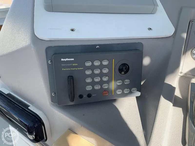Slide: The Image of Raytheon navigation system on 1994 Cruisers Yachts Express Bridge. - 21
