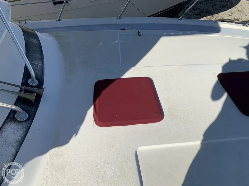 Slide: The Image of 1994 Cruisers Yachts Express Bridge deck with red hatch covers. - 29