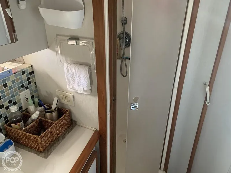 Slide: The Image of 1994 Cruisers Yachts Express Bridge bathroom with shower and vanity area. - 50