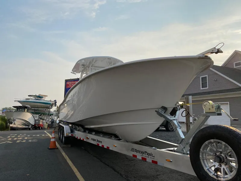 The Image of 2024 Cape Horn 34 XS boat on trailer in marina. - 0