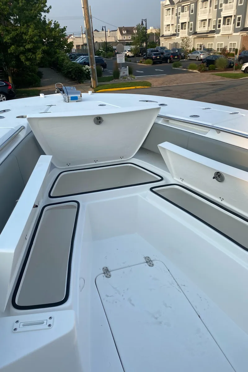 Slide: The Image of 2024 Cape Horn 34 XS boat with open storage compartments. - 13