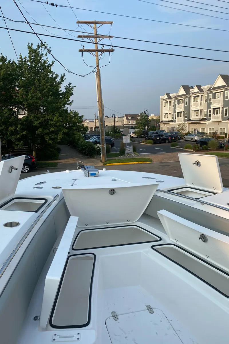 Slide: The Image of 2024 Cape Horn 34 XS boat with open storage compartments. - 14