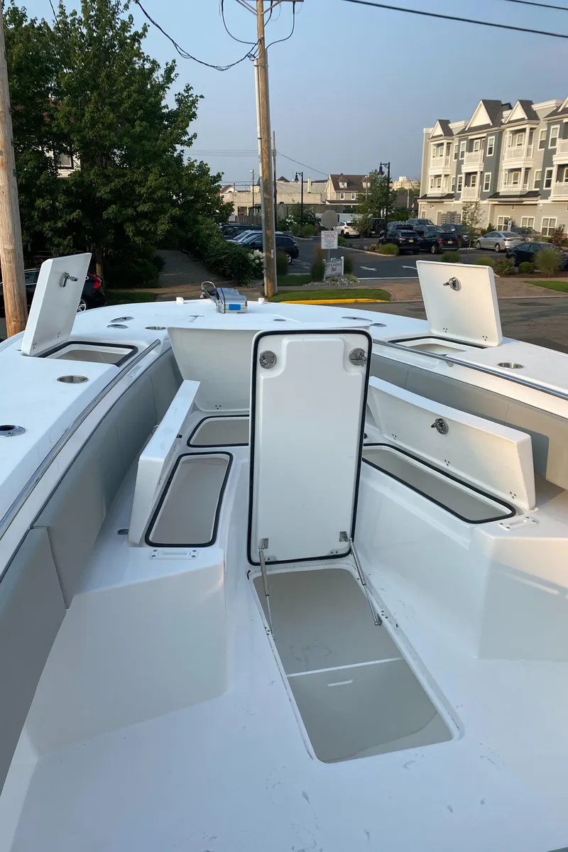 Slide: The Image of 2024 Cape Horn 34 XS boat with open storage compartments. - 15