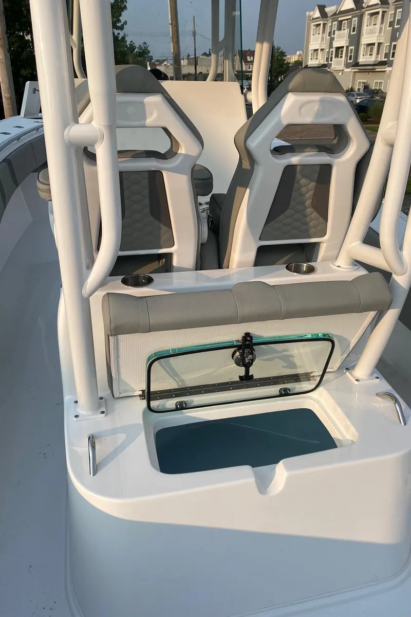 Slide: The Image of 2024 Cape Horn 34 XS boat interior with seating and storage compartment. - 21