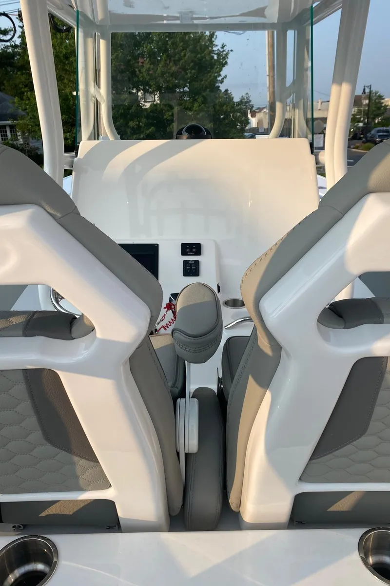 Slide: The Image of 2024 Cape Horn 34 XS boat interior with dual seats and control panel. - 22