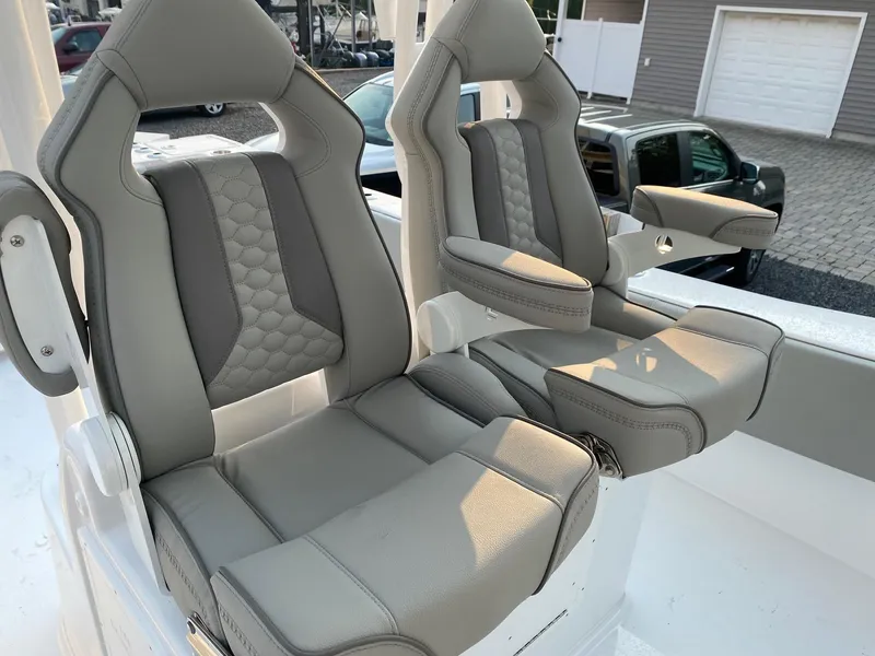 Slide: The Image of 2024 Cape Horn 34 XS boat seats with armrests and quilted upholstery. - 24