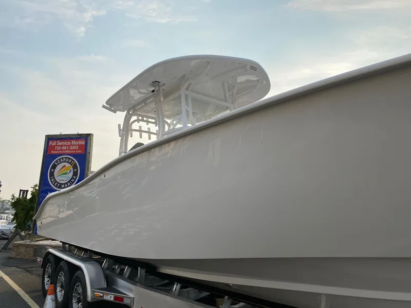 Slide: The Image of 2024 Cape Horn 34 XS boat on a trailer at a marina. - 3