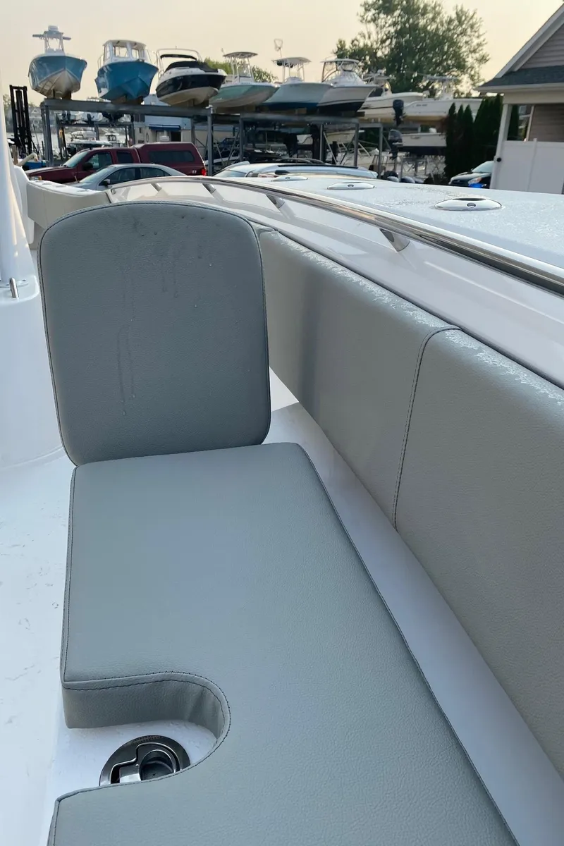Slide: The Image of 2024 Cape Horn 34 XS boat seating area with gray cushions. - 7