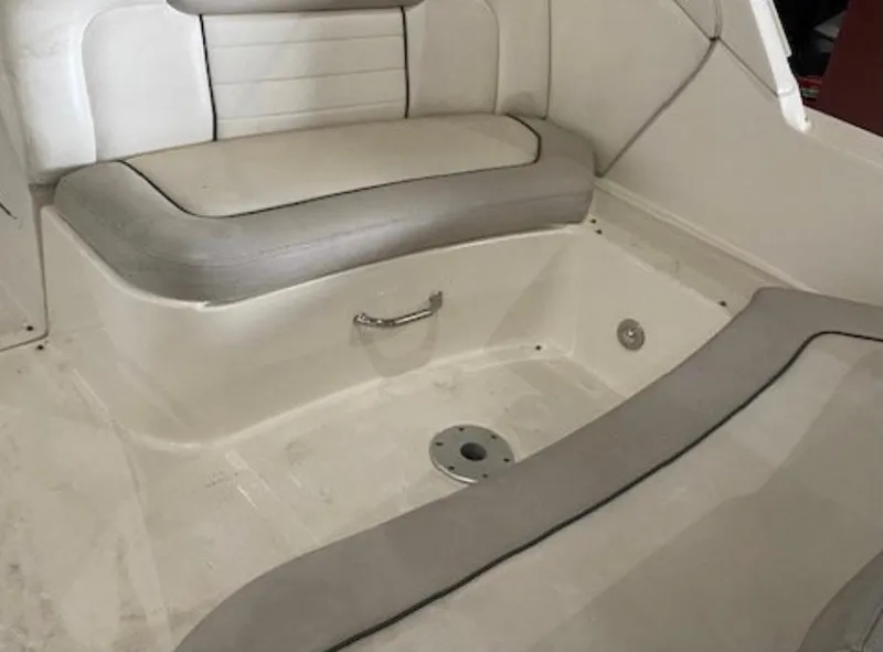 Slide: The Image of Interior of a 2010 Sea Ray Sundancer 330 with gray upholstery and a metal handle. - 12