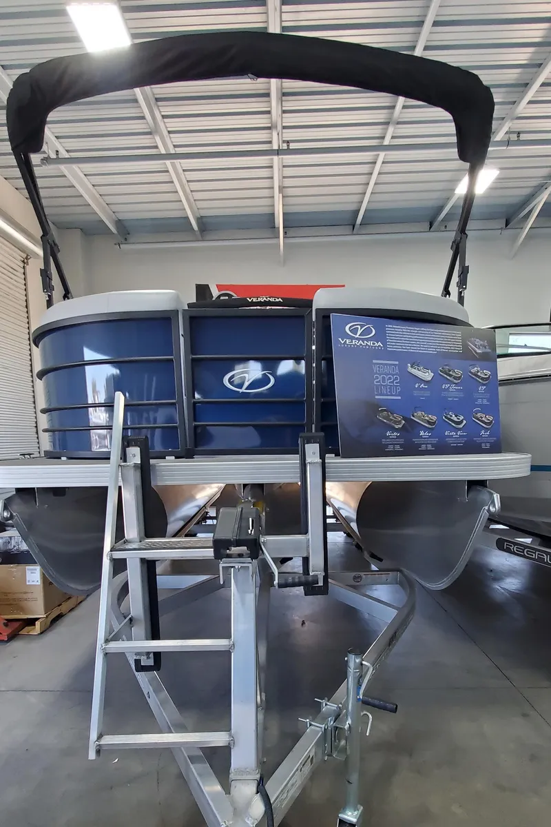 Slide: The Image of 2022 Veranda VISTA VIEW 22RC pontoon boat on trailer in showroom. - 2