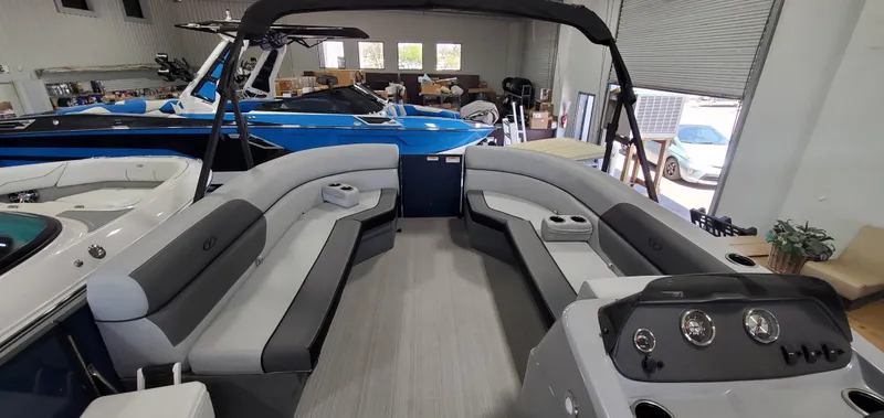 Slide: The Image of 2022 Veranda VISTA VIEW 22RC pontoon boat interior with spacious seating and modern dashboard. - 7