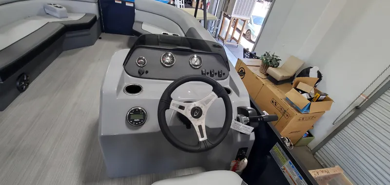 Slide: The Image of 2022 Veranda VISTA VIEW 22RC boat interior with steering wheel and control panel. - 9