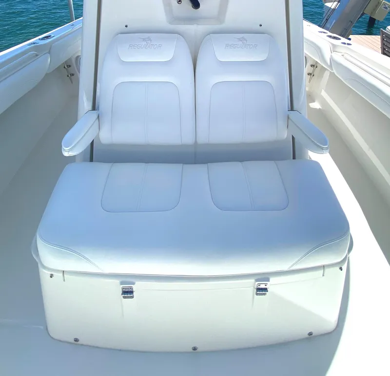 Slide: The Image of 2020 Regulator 31 boat with white cushioned seating. - 17