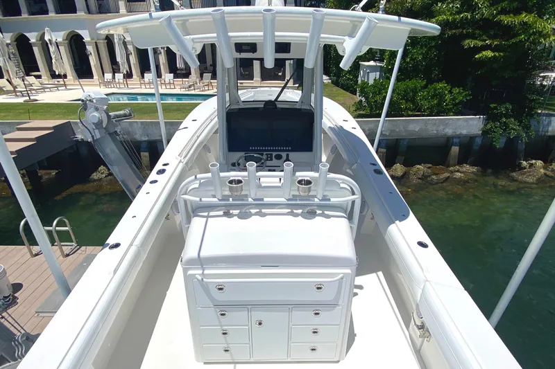 Slide: The Image of 2020 Regulator 31 boat interior with helm station and storage compartments. - 19