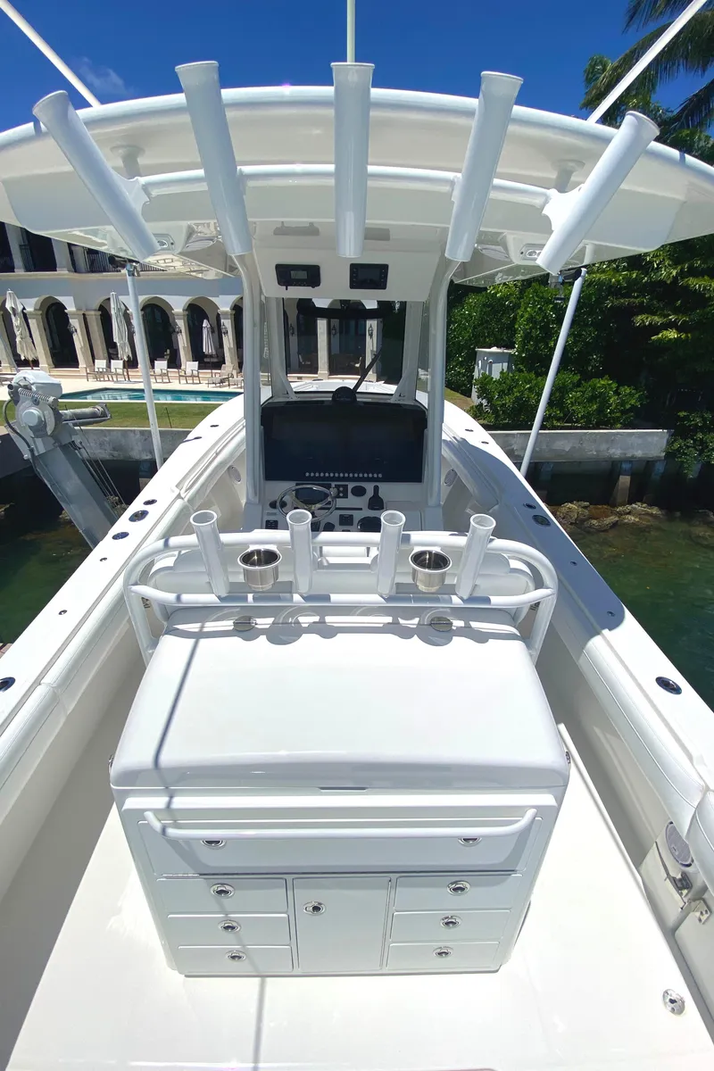 Slide: The Image of 2020 Regulator 31 boat with rod holders and storage compartments. - 22