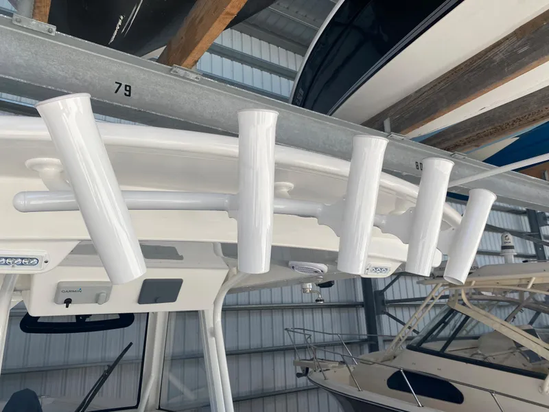 Slide: The Image of 2020 Regulator 31 boat with rod holders in storage. - 26