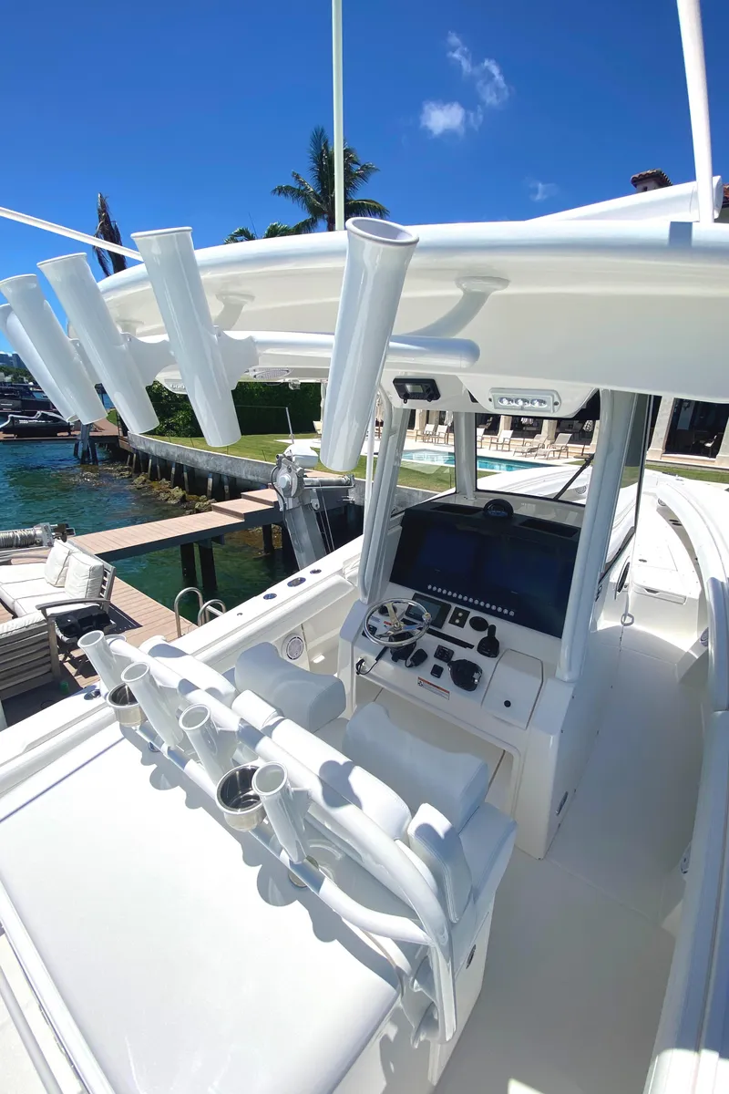 Slide: The Image of 2020 Regulator 31 boat cockpit with helm and rod holders. - 27