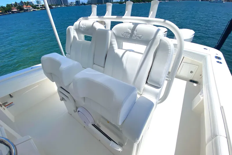 Slide: The Image of 2020 Regulator 31 boat with white seating, ocean view in the background. - 29