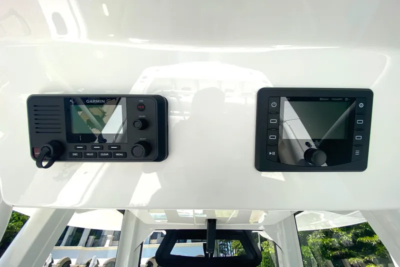 Slide: The Image of Garmin and other electronic displays on the 2020 Regulator 31 boat dashboard. - 41