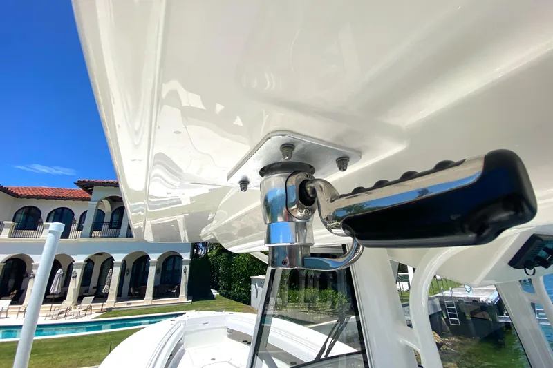 Slide: The Image of 2020 Regulator 31 boat detail with luxury villa in background. - 43