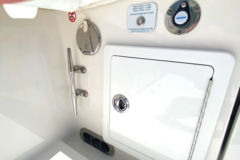 Slide: The Image of 2020 Regulator 31 boat deck with storage compartment and cleat. - 44