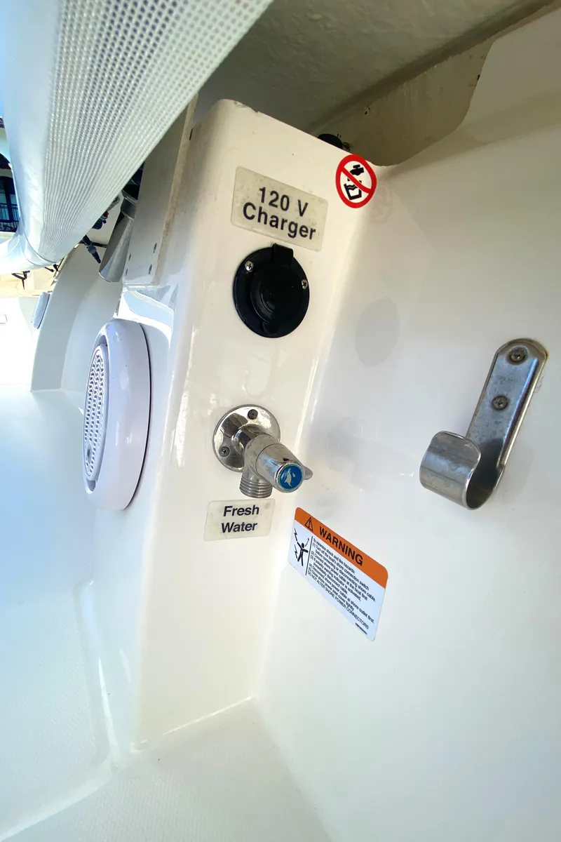 Slide: The Image of 2020 Regulator 31 boat with 120V charger and fresh water outlet. - 46