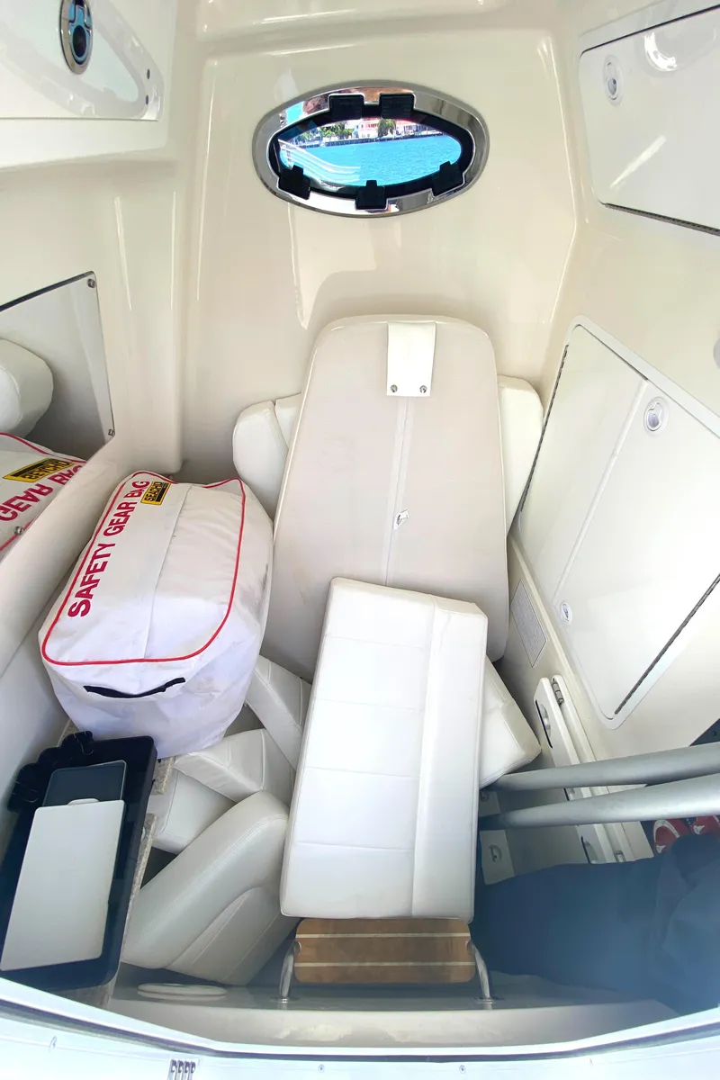 Slide: The Image of 2020 Regulator 31 boat cabin interior with safety gear and seating. - 49