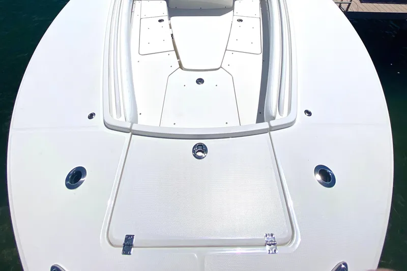 Slide: The Image of 2020 Regulator 31 boat bow deck with storage compartments. - 7
