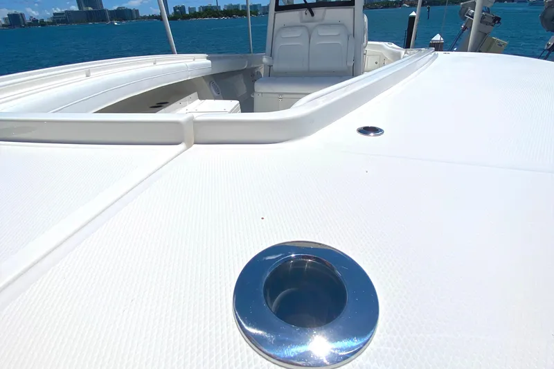 Slide: The Image of 2020 Regulator 31 boat deck with seating, ocean view in background. - 9