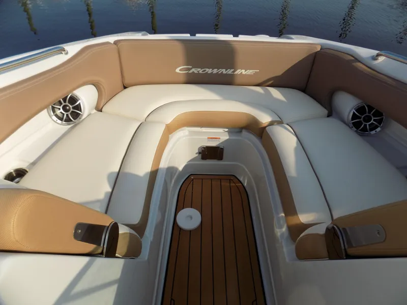 Slide: The Image of 2020 Crownline Eclipse E235 XS boat interior with tan and white seating. - 7