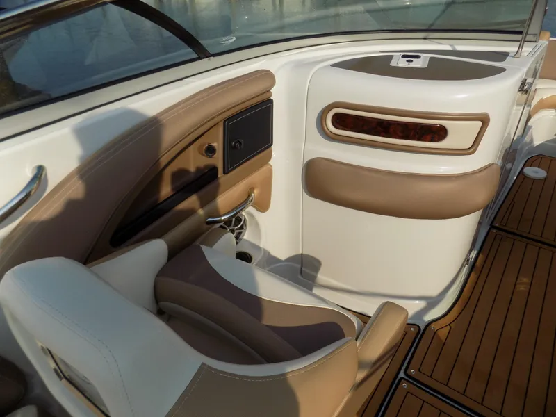 Slide: The Image of Interior of 2020 Crownline Eclipse E235 XS boat with tan and white seating. - 9