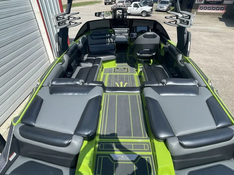Slide: The Image of 2016 Malibu M235 boat interior with green and black seating. - 4