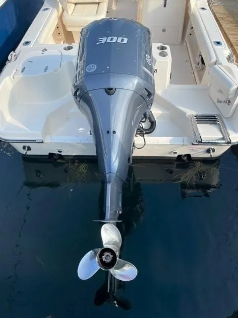 Slide: The Image of 2016 Grady-White Freedom 255 boat with outboard motor. - 14