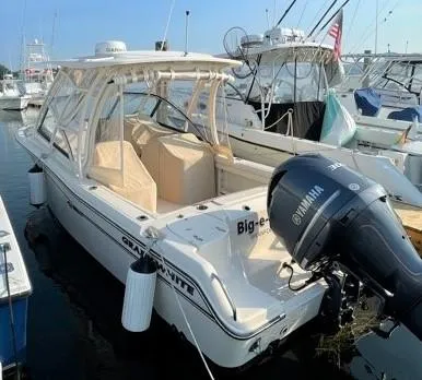 Slide: The Image of 2016 Grady-White Freedom 255 boat docked with Yamaha outboard motor. - 3