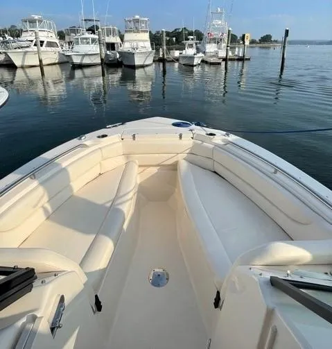 Slide: The Image of 2016 Grady-White Freedom 255 boat docked in marina. - 4