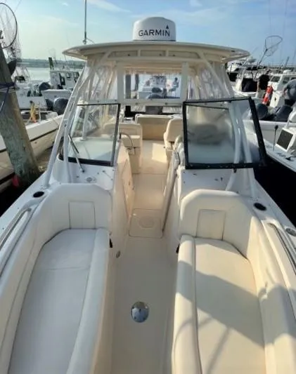 Slide: The Image of 2016 Grady-White Freedom 255 boat with Garmin equipment in harbor. - 6