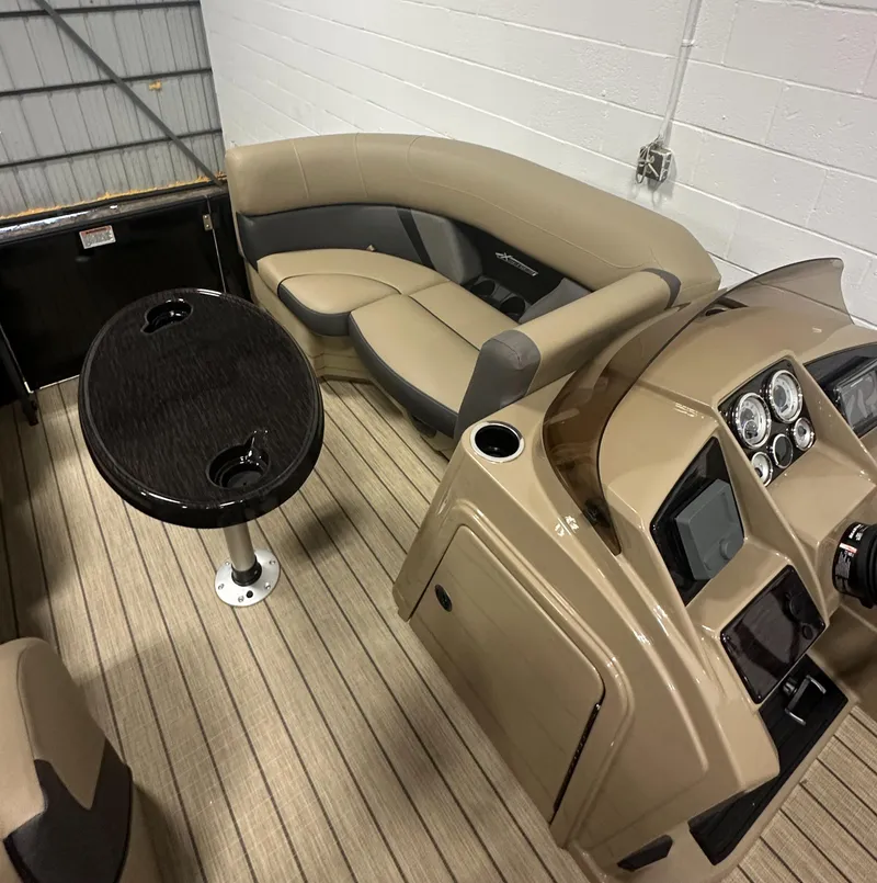 Slide: The Image of 2025 Sylvan MIRAGE X1 CLZ DH boat interior with seating and control panel. - 18